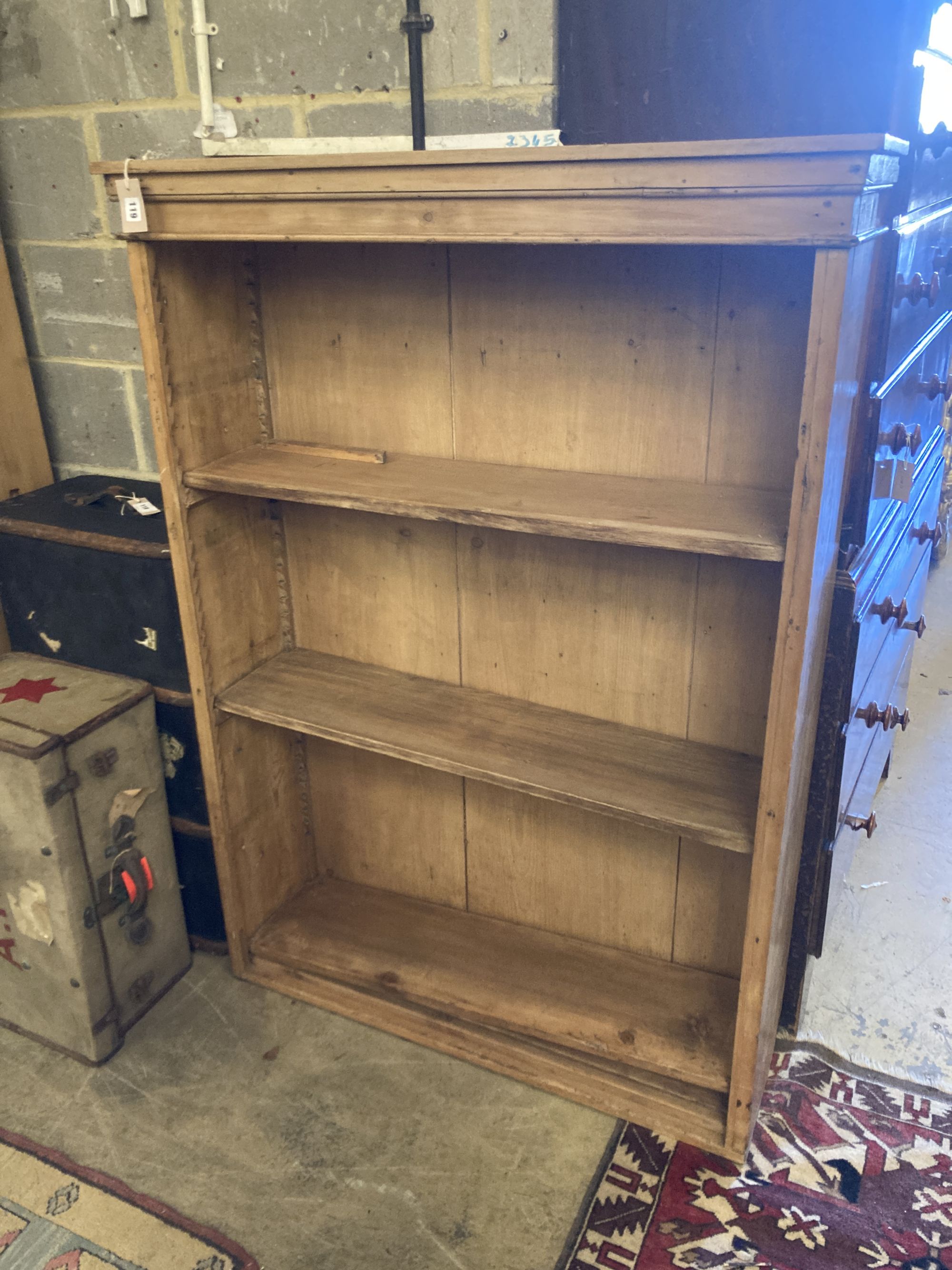 A Victorian pine open bookcase, width 108cm, depth 31cm, height 152cm